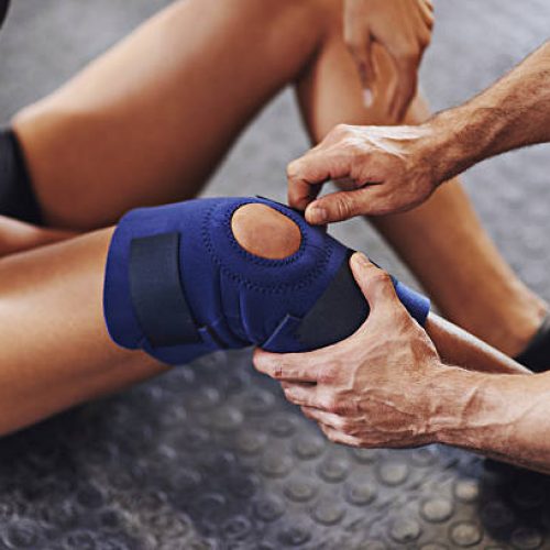 Shot of a sportswoman being helped with a knee injuryhttp://195.154.178.81/DATA/i_collage/pi/shoots/806023.jpg